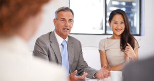 Business consultant talking to new clients about savings